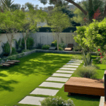 页面模板0_初版 24 Spacious backyard with artificial turf, modern stepping stones, wooden bench seating, and lush green trees providing shade.