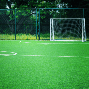 Football 2 Football turf field with goalposts and white markings for the penalty area