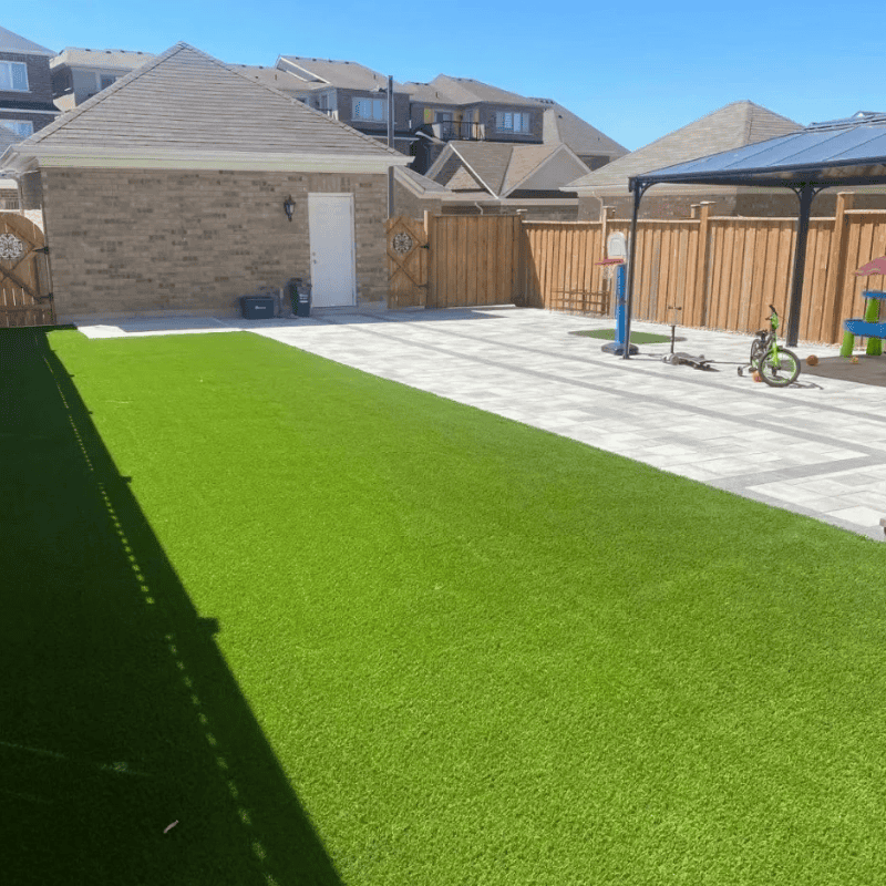 We Are a Global Leader in Artificial Grass Solutions 18 artificial grass installed in residential backyard creating a green and low maintenance outdoor play area 1