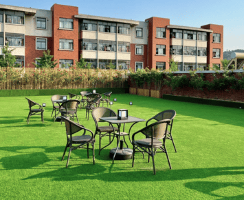 Commercial 13 commercial artificial grass installed on concrete balcony providing a lush and maintenance free outdoor space with elegant white railing