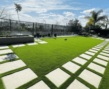 Commercial 10 commercial artificial grass with pavers creating a stylish and low maintenance outdoor space with clean lines and green turf