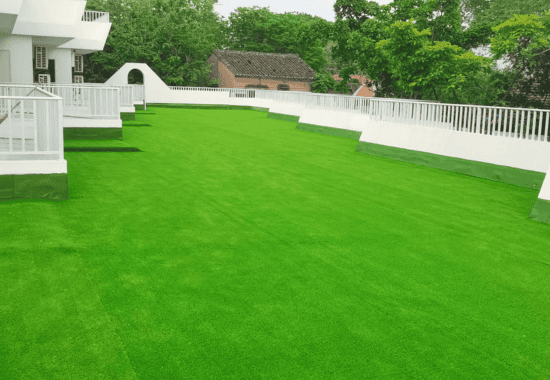 Custom Turf 8 custom artificial grass installation on rooftop terrace providing a lush green surface for special uses