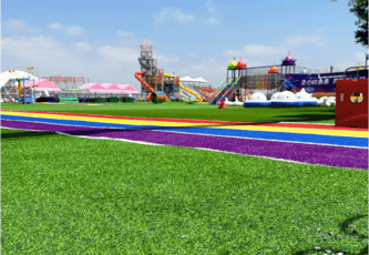 Playground 12 playground turf with vibrant colored paths and playground equipment