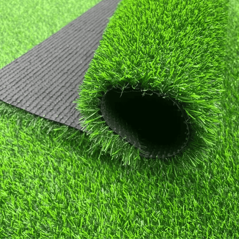rolled up artificial grass mat with black backing showing lush green synthetic grass for outdoor or indoor installation easy to install