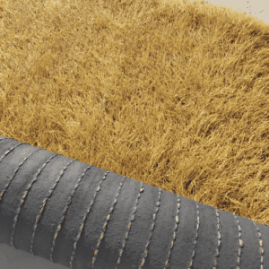 synthetic-thatch-roof-roll-partially-unrolled-displaying-golden-fibers-outdoors