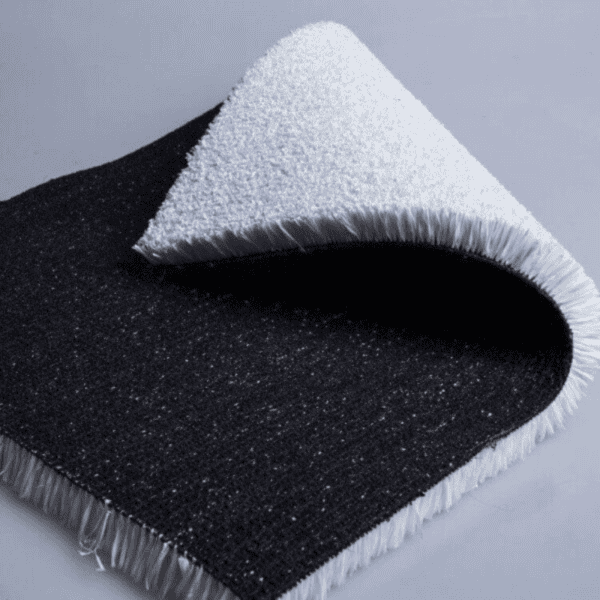 white artificial grass roll with black backing partially unrolled