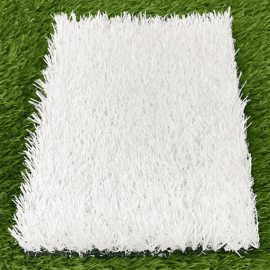 white artificial grass sample on green background showing realistic fibers