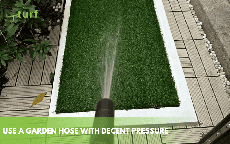 How to Clean Dog Urine from Fake Grass the Right Way 2 Cleaning artificial grass with a garden hose to remove dog urine