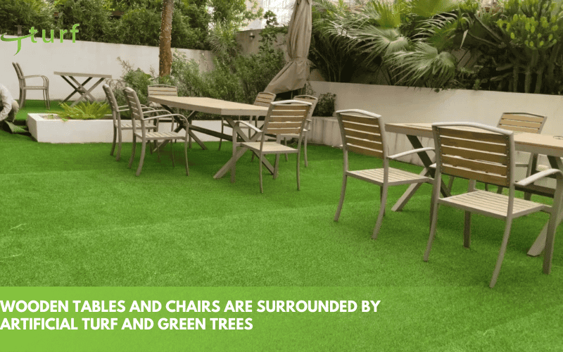 23 Inspiring Fake Grass Patio Ideas for a Beautiful, Low-Maintenance Patio 1 artificial grass laid out around wooden table and chairs with lush greenery and natural surroundings