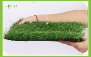 durable artificial turf sample demonstrating efficient drainage with water pouring through