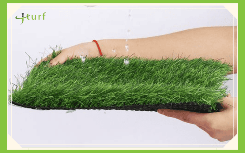 durable artificial turf sample demonstrating efficient drainage with water pouring through