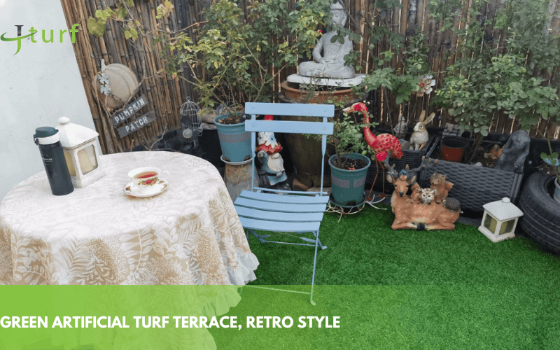 23 Inspiring Fake Grass Patio Ideas for a Beautiful, Low-Maintenance Patio 6 green synthetic grass patio with colorful flower pots and a small table for a cozy outdoor setting