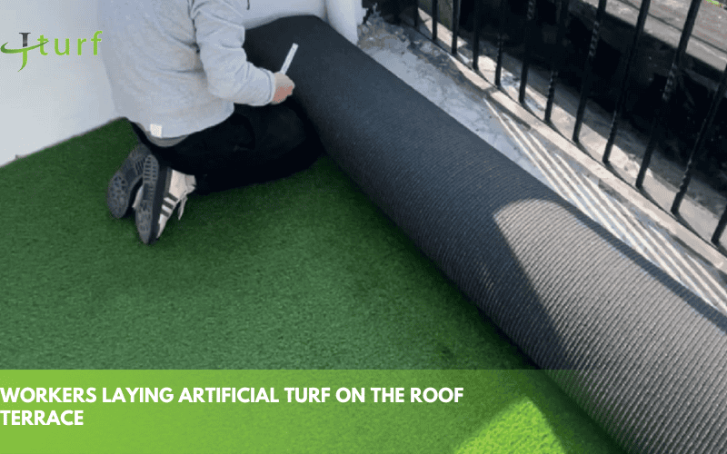23 Inspiring Fake Grass Patio Ideas for a Beautiful, Low-Maintenance Patio 9 person laying down synthetic turf on rooftop patio during installation process for a perfect outdoor surface