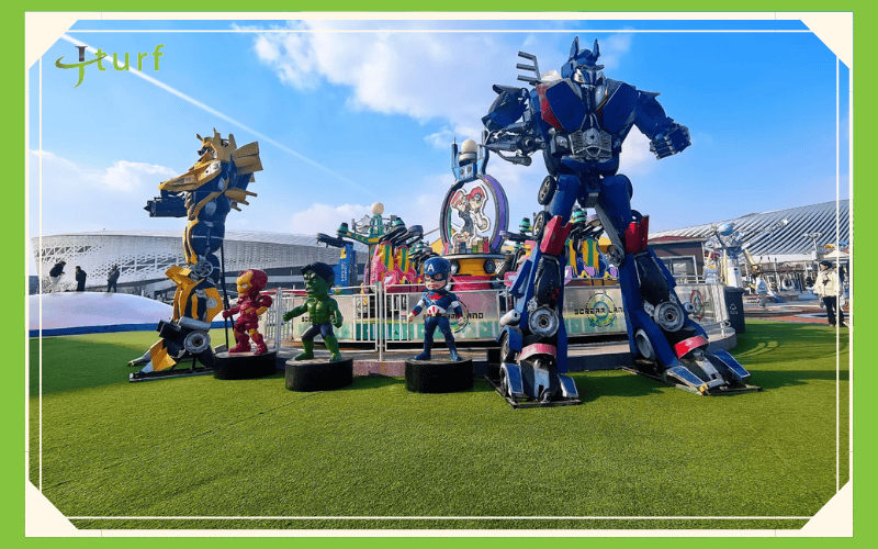 synthetic grass amusement park with superhero statues display