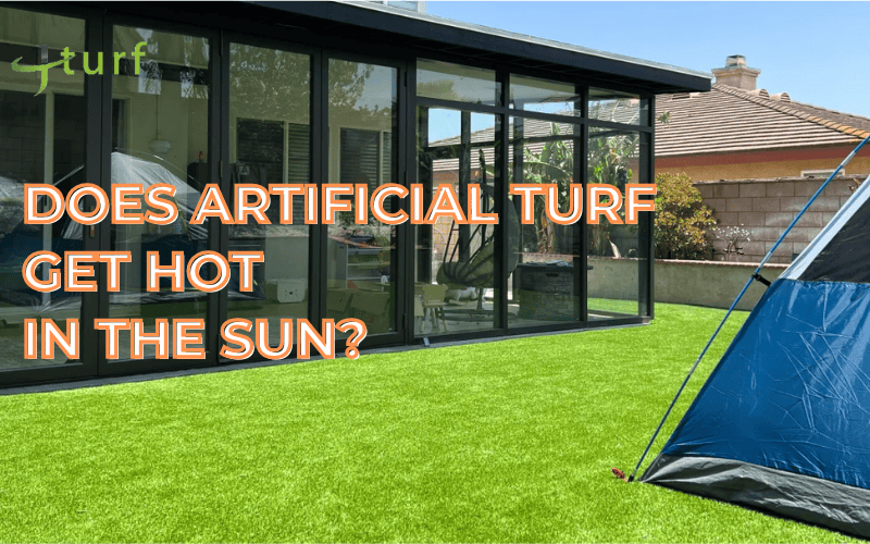 Artificial turf in a sunny backyard beside glass house and camping tent