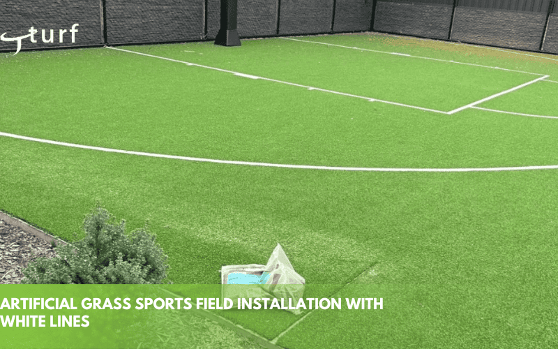 artificial grass sports field installation with white lines