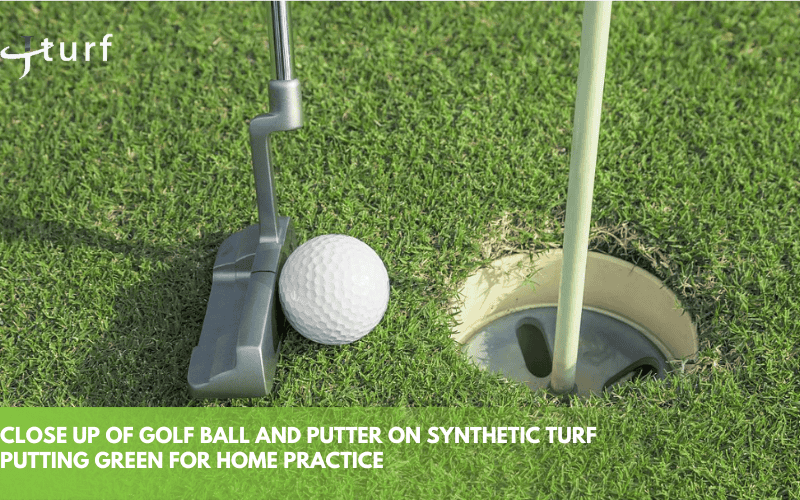 close up of golf ball and putter on synthetic turf putting green for home practice