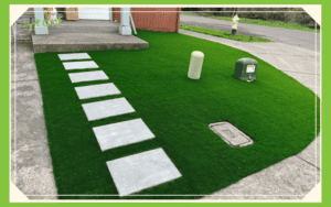 front yard artificial turf with stepping stones and utility covers