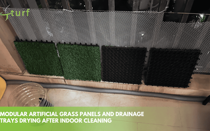 modular artificial grass panels and drainage trays drying after indoor cleaning