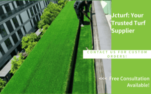 rooftop artificial turf installation in progress with worker trimming edge