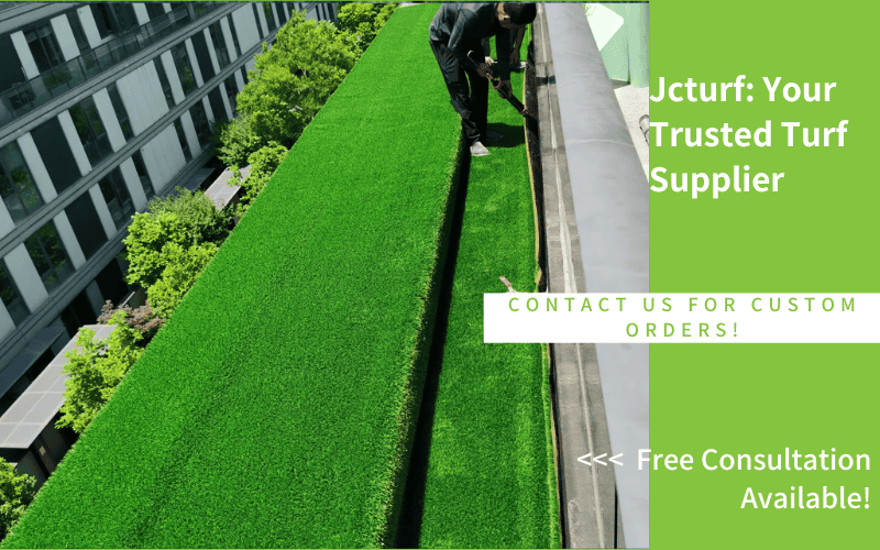 rooftop artificial turf installation in progress with worker trimming edge