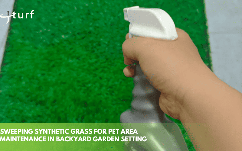sweeping synthetic grass for pet area maintenance in backyard garden setting