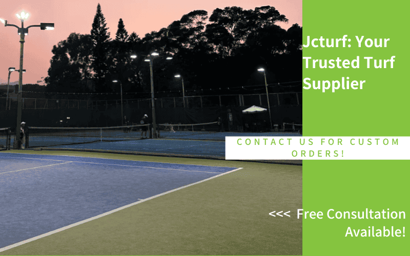 tennis court with artificial turf and lights during evening practice