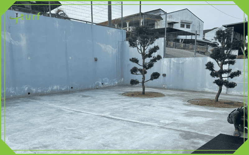 concrete yard prepared for artificial grass installation