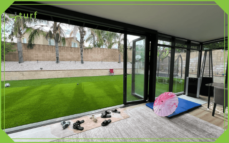 lush artificial grass lawn viewed from indoor living area