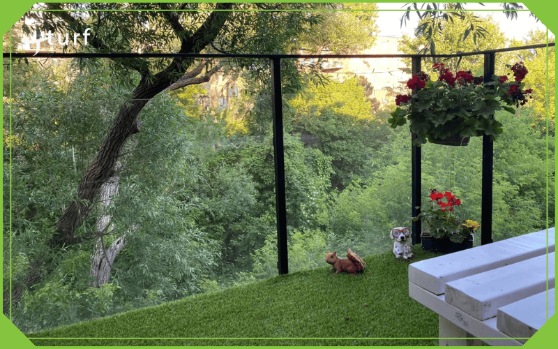 turf for balcony or terrace with glass railing and potted flowers