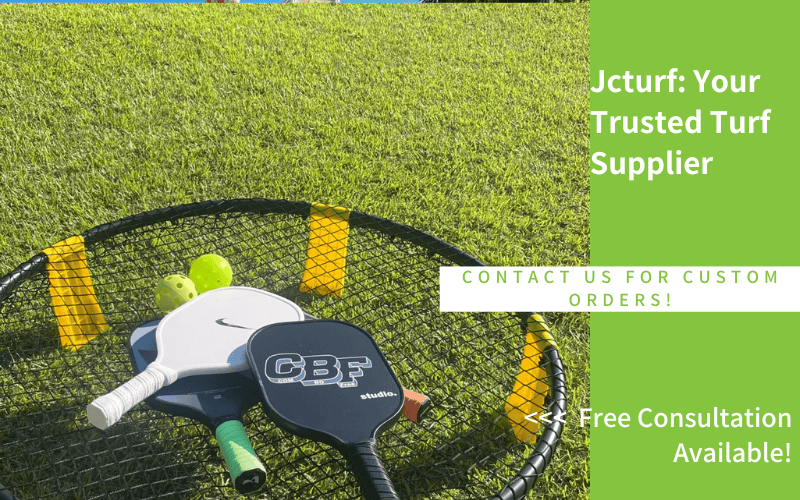 pickleball paddles and balls resting on a net frame on a green artificial grass