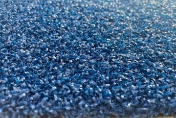 detailed close-up of blue padel artificial grass durable synthetic turf with low maintenance for sports use