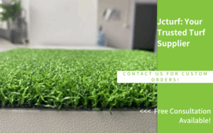 A close-up of a green artificial turf sample displayed with promotional text for a turf supplier.