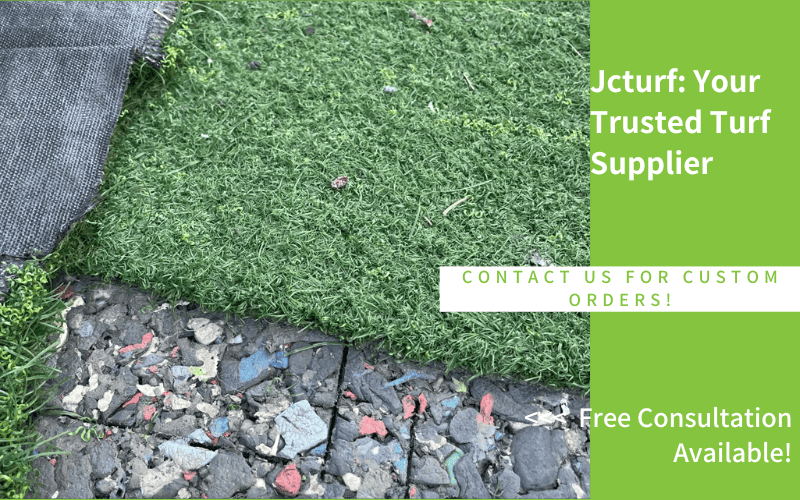 A close-up of artificial turf laid over gravel, with promotional text for a turf supplier on the right side.