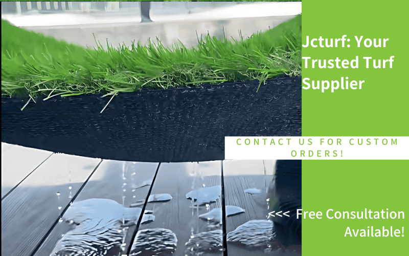 A close-up of artificial turf on a black edge, with water droplets on a wooden surface and promotional text beside it.