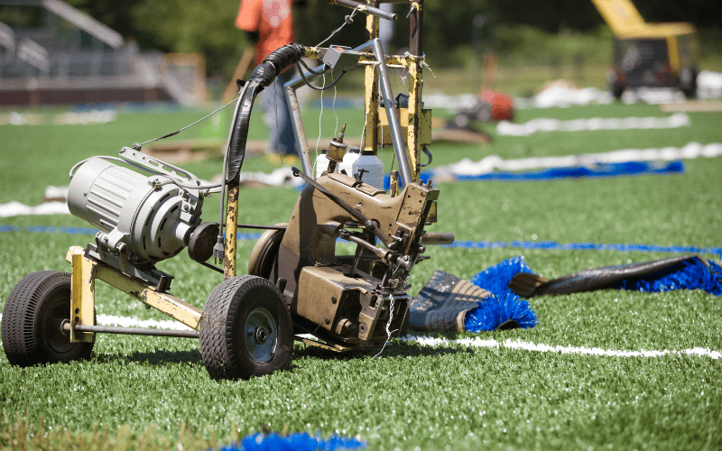 Machine used for maintenance on artificial sports turf field Machine used for maintenance on artificial sports turf field